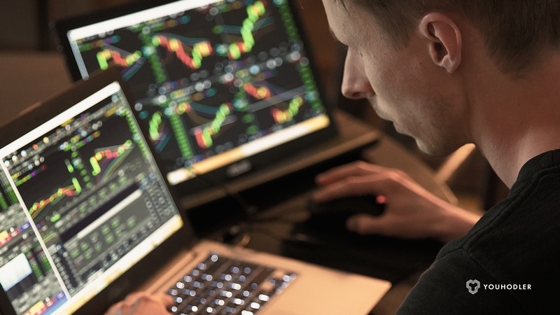 crypto-trader-looking-at-monitors